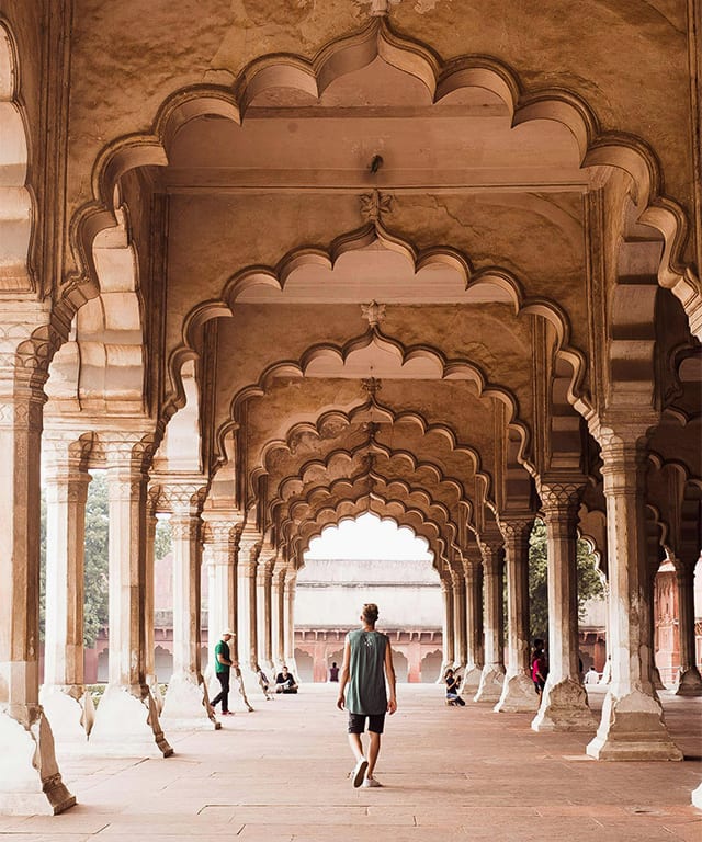 A Man walking through the Diwan-i-Am in the Red Fort of Delhi